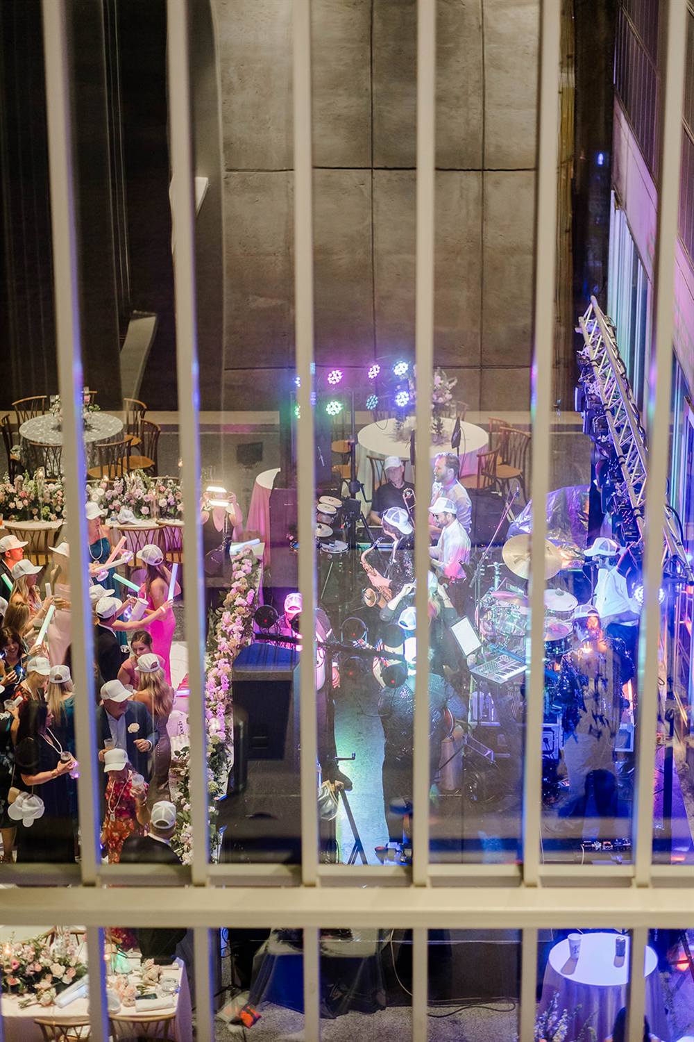 A colorfully lit event space glowing at night